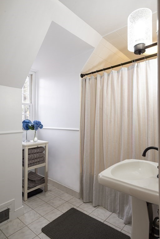 16 Granite Street Wellesley, MA 02482 - Photo 12 of 14 a bathroom with a sink and a mirror