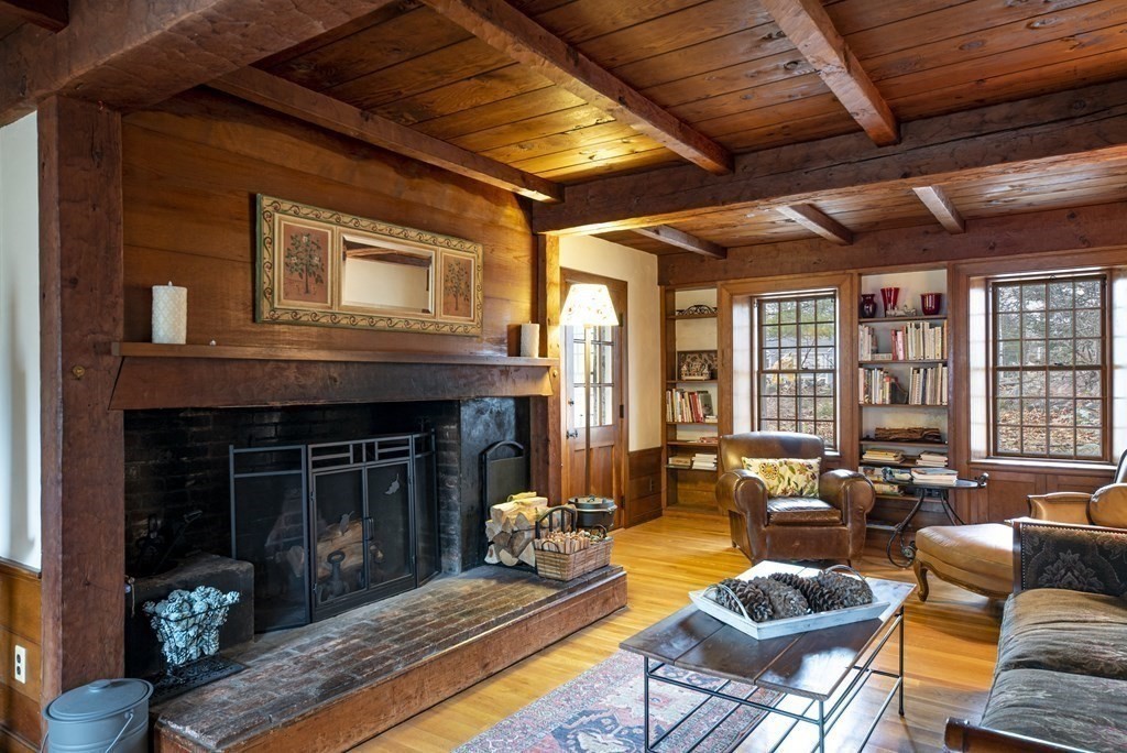 16 Granite Street Wellesley, MA 02482 - Photo 3 of 14 a living room with patio furniture and a fireplace
