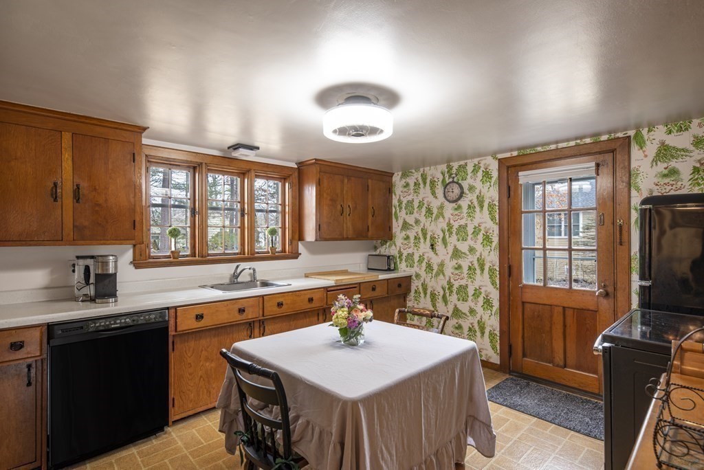 16 Granite Street Wellesley, MA 02482 - Photo 7 of 14 a kitchen with a sink stove and microwave