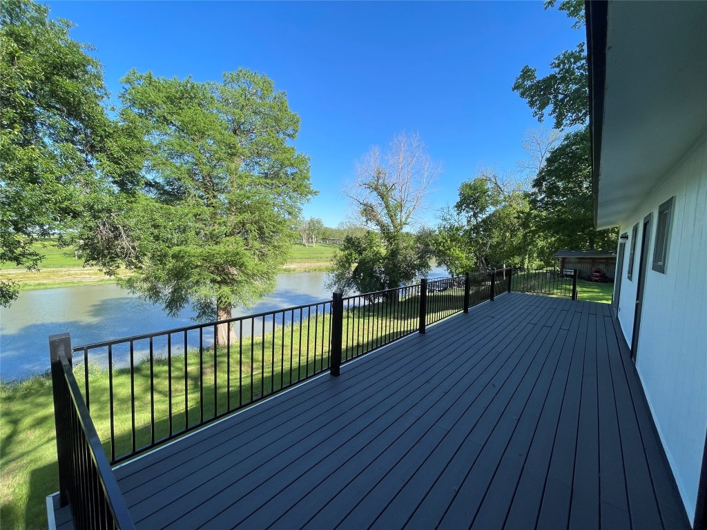a view of a balcony with wooden floor