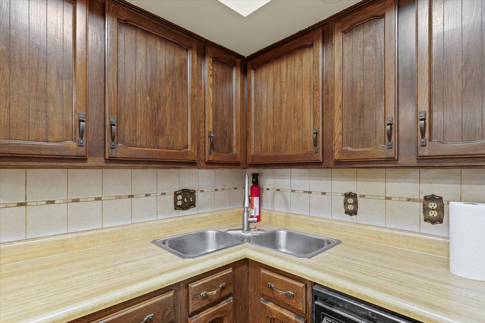 309 North Watson Street Tolono, IL 61880 - Photo 14 of 33 a kitchen with stainless steel appliances granite countertop wooden cabinets a sink and dishwasher