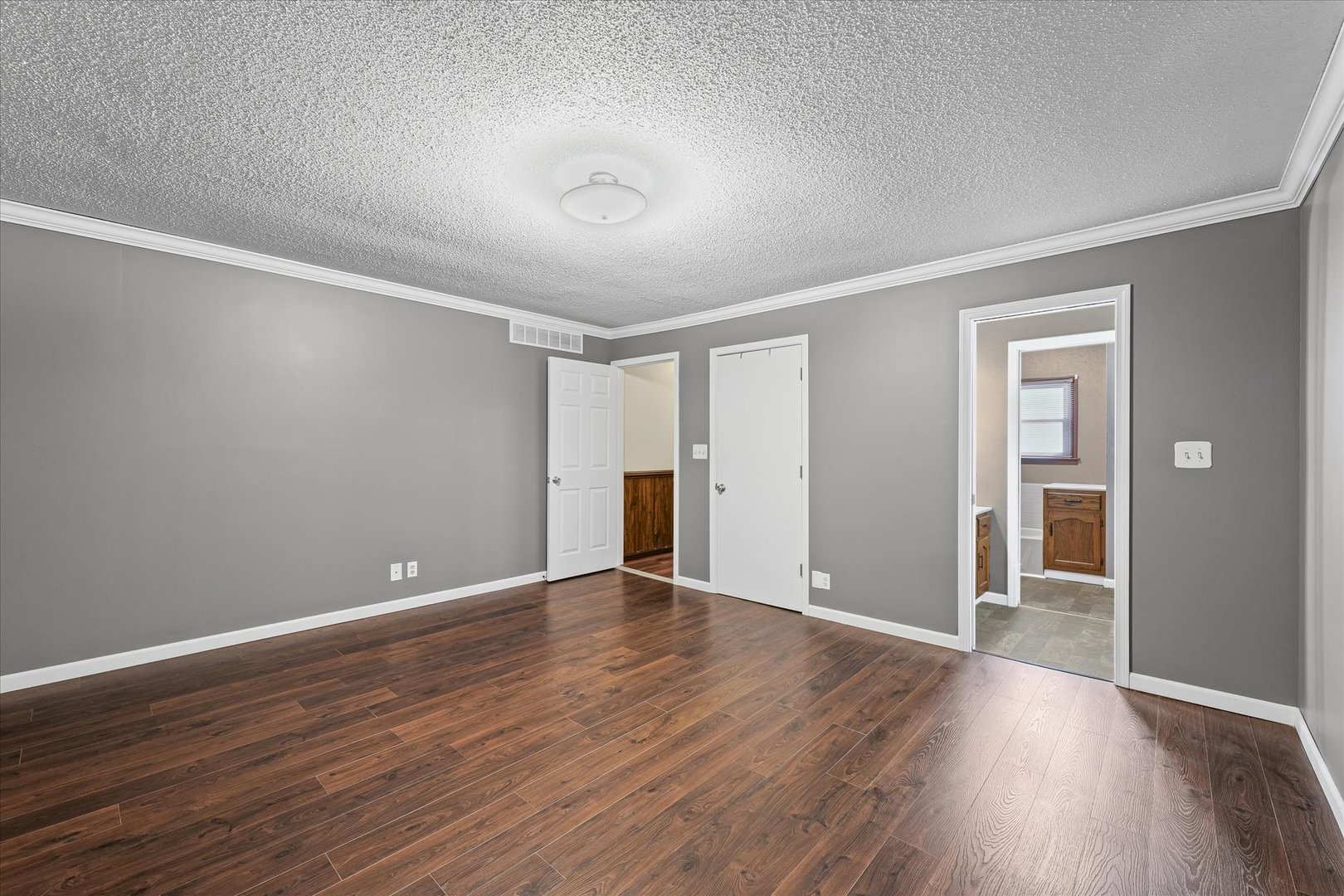 309 North Watson Street Tolono, IL 61880 - Photo 17 of 33 a view of an empty room with wooden floor