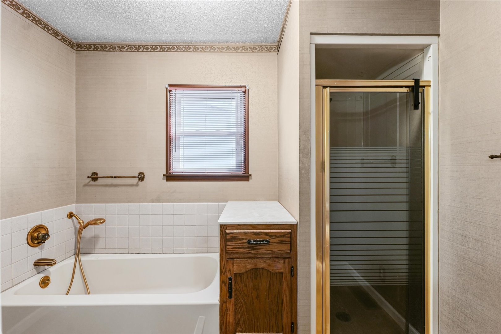 309 North Watson Street Tolono, IL 61880 - Photo 19 of 33 a bathroom with a bathtub and a window