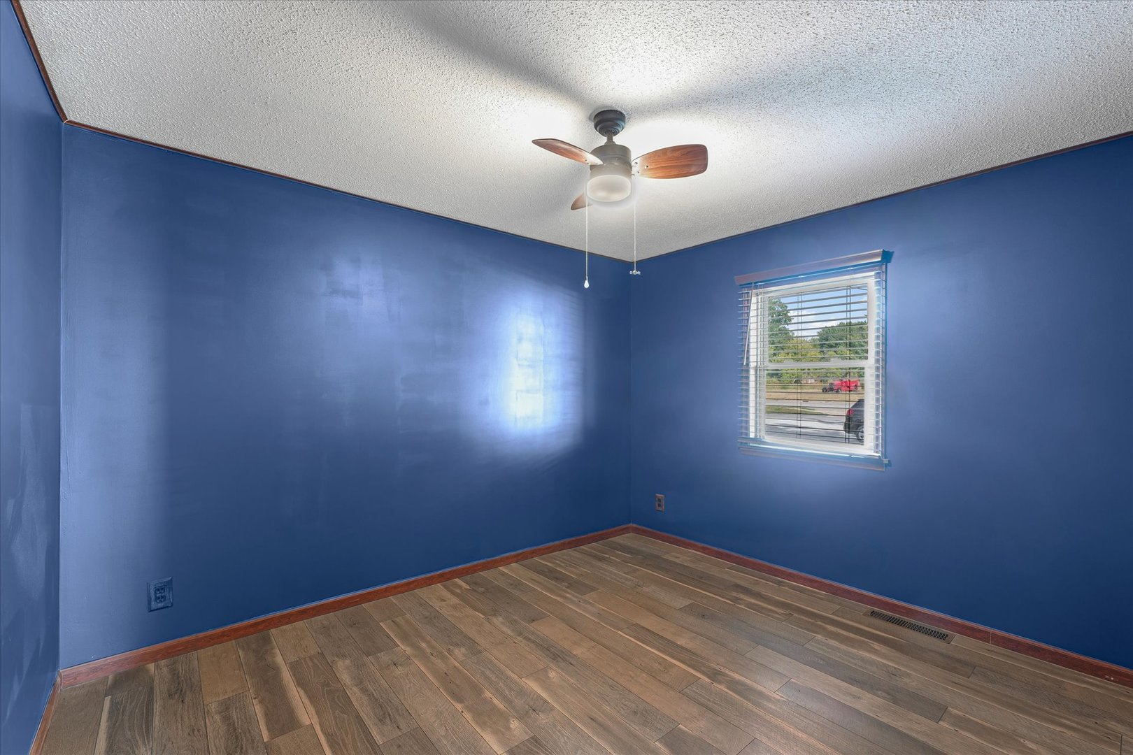 309 North Watson Street Tolono, IL 61880 - Photo 20 of 33 an empty room with a window and a ceiling fan