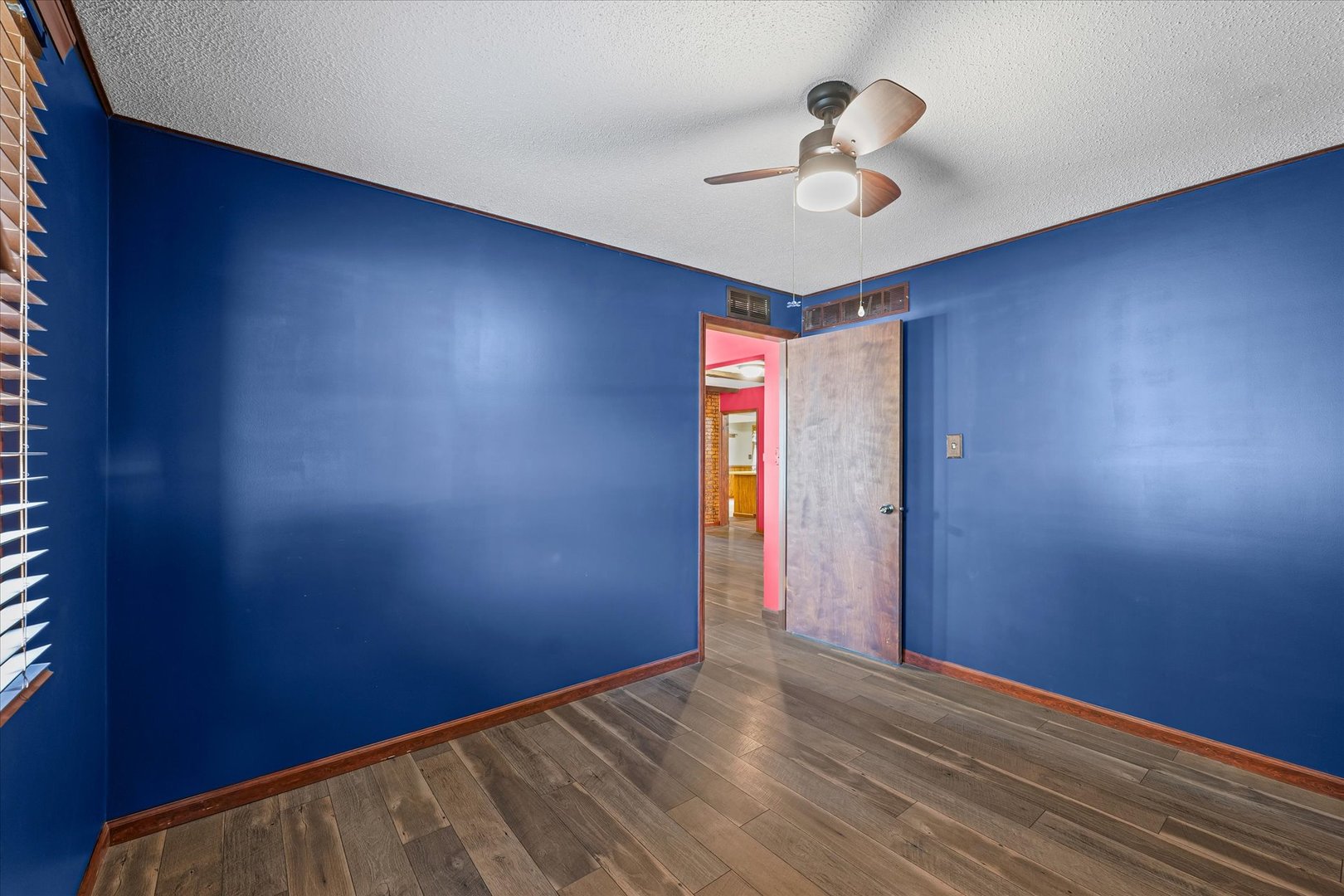 309 North Watson Street Tolono, IL 61880 - Photo 21 of 33 wooden floor in an empty room with a window
