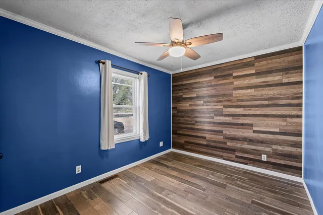 a view of room with window and ceiling fan