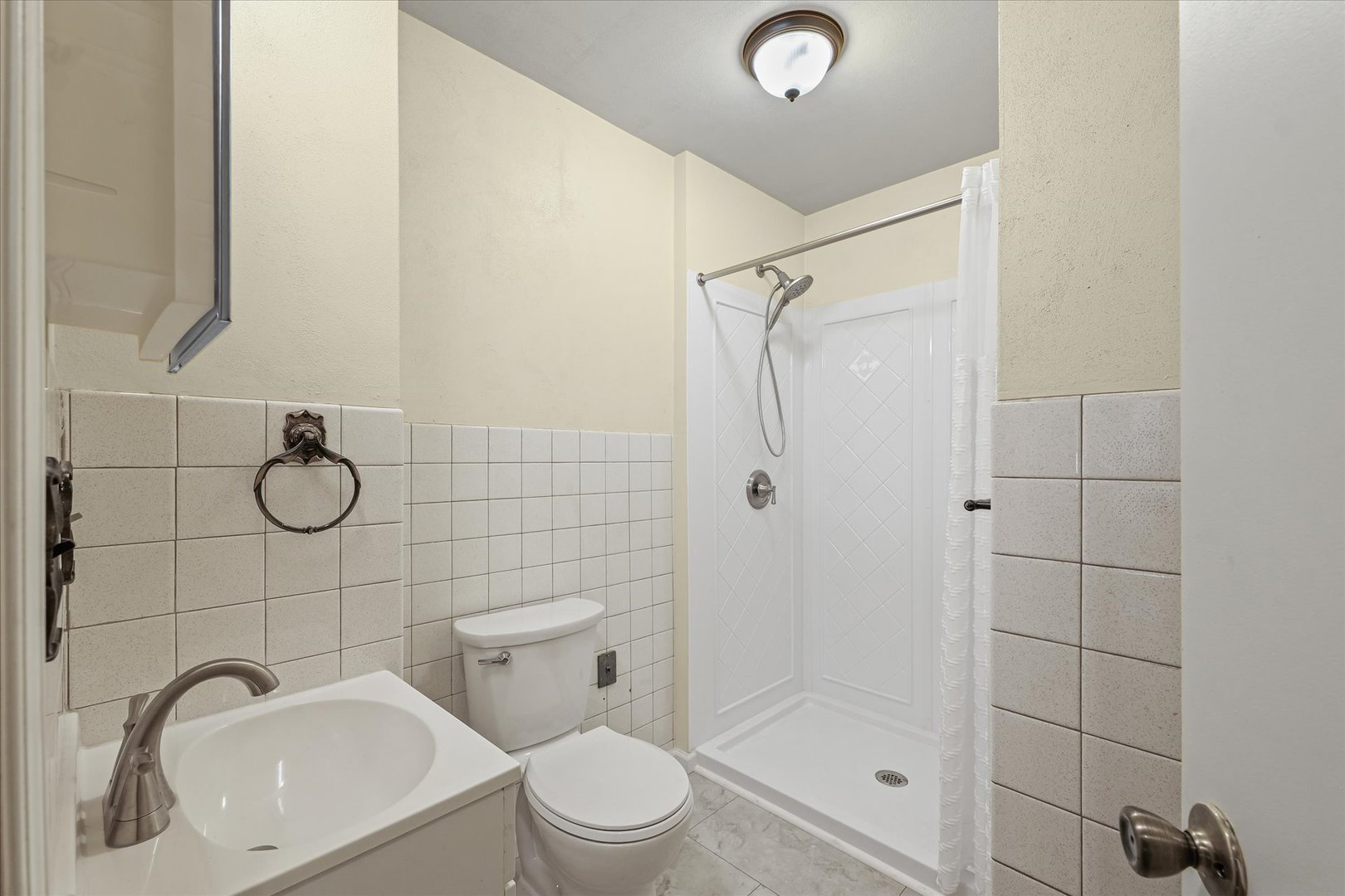 309 North Watson Street Tolono, IL 61880 - Photo 24 of 33 a bathroom with a toilet sink and shower