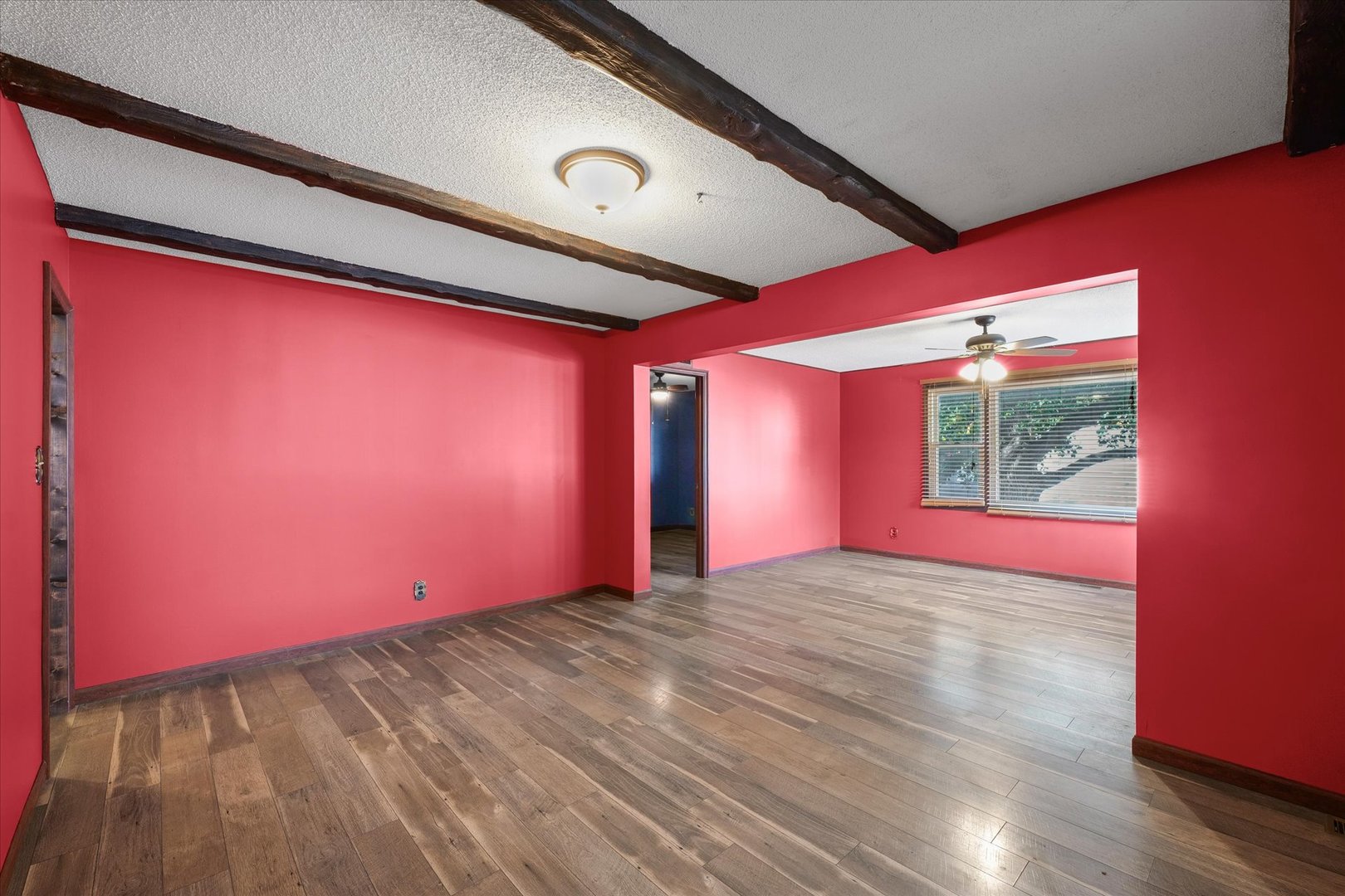 309 North Watson Street Tolono, IL 61880 - Photo 6 of 33 a view of empty room with wooden floor and fan