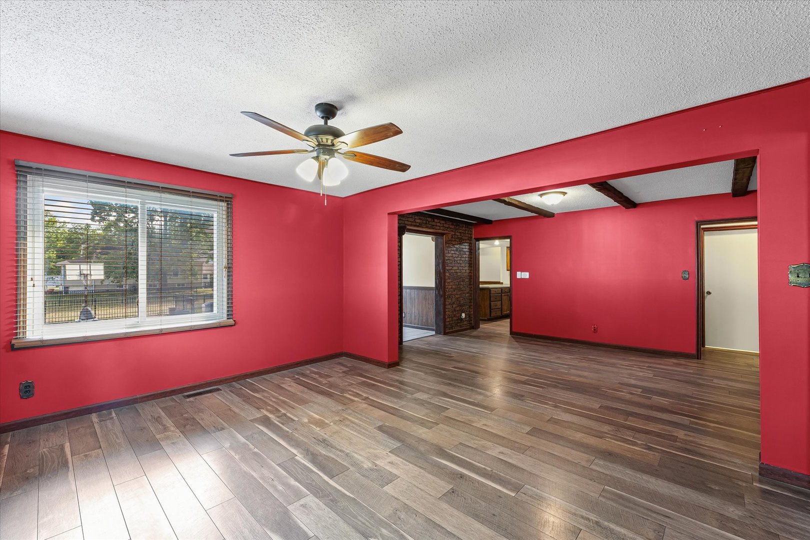 309 North Watson Street Tolono, IL 61880 - Photo 8 of 33 a view of empty room with wooden floor and fan