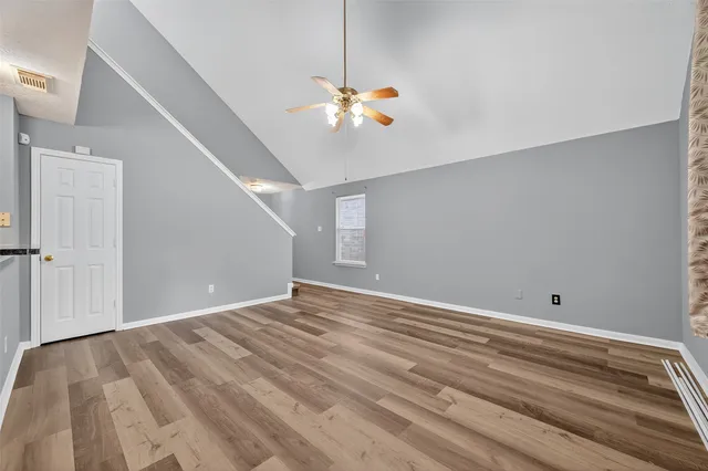 a view of room with window and ceiling fan