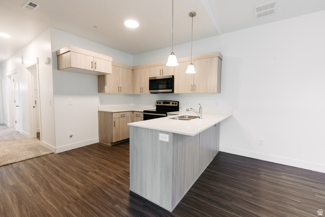 4655 South 720 West, Unit I304 Mapleton, UT 84664 - Photo 12 of 16 Kitchen featuring light wood finish cabinets, a peninsula, stainless steel appliances, pendant lighting, and dark wood-style flooring