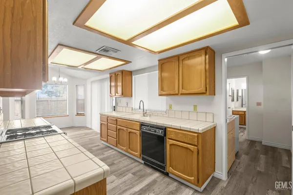 a spacious bathroom with a double vanity sink a mirror and a bathtub