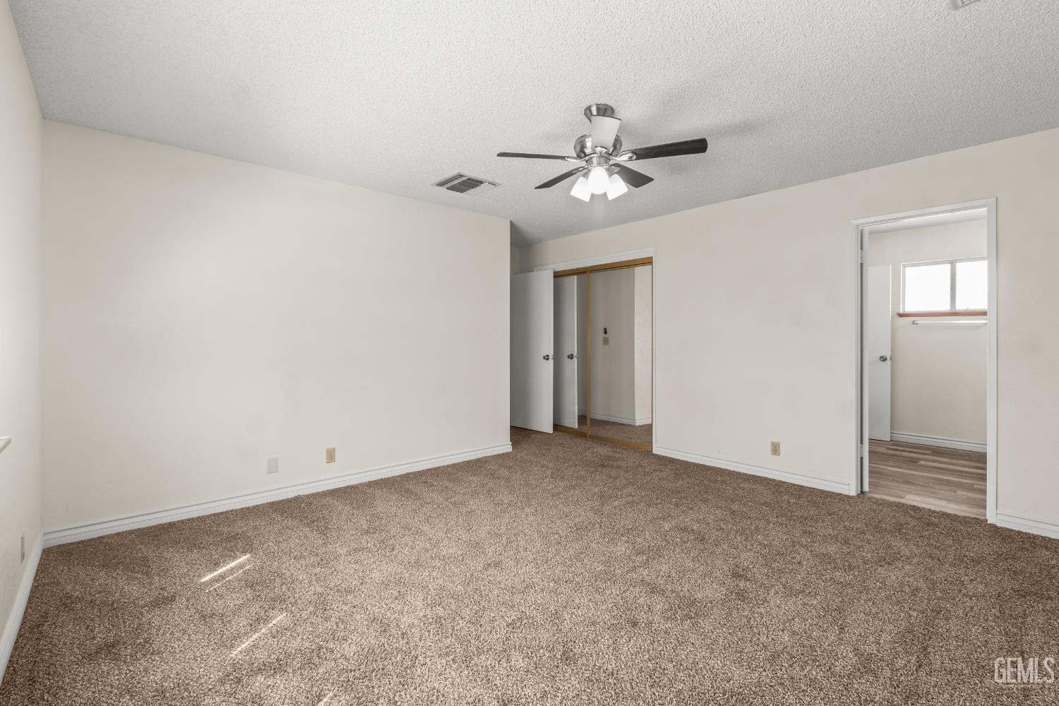 Undisclosed Address Ridgecrest, CA 93555 - Photo 14 of 28 a view of an empty room with a ceiling fan