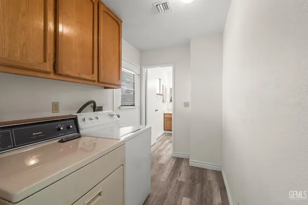 a room with a sink and cabinets