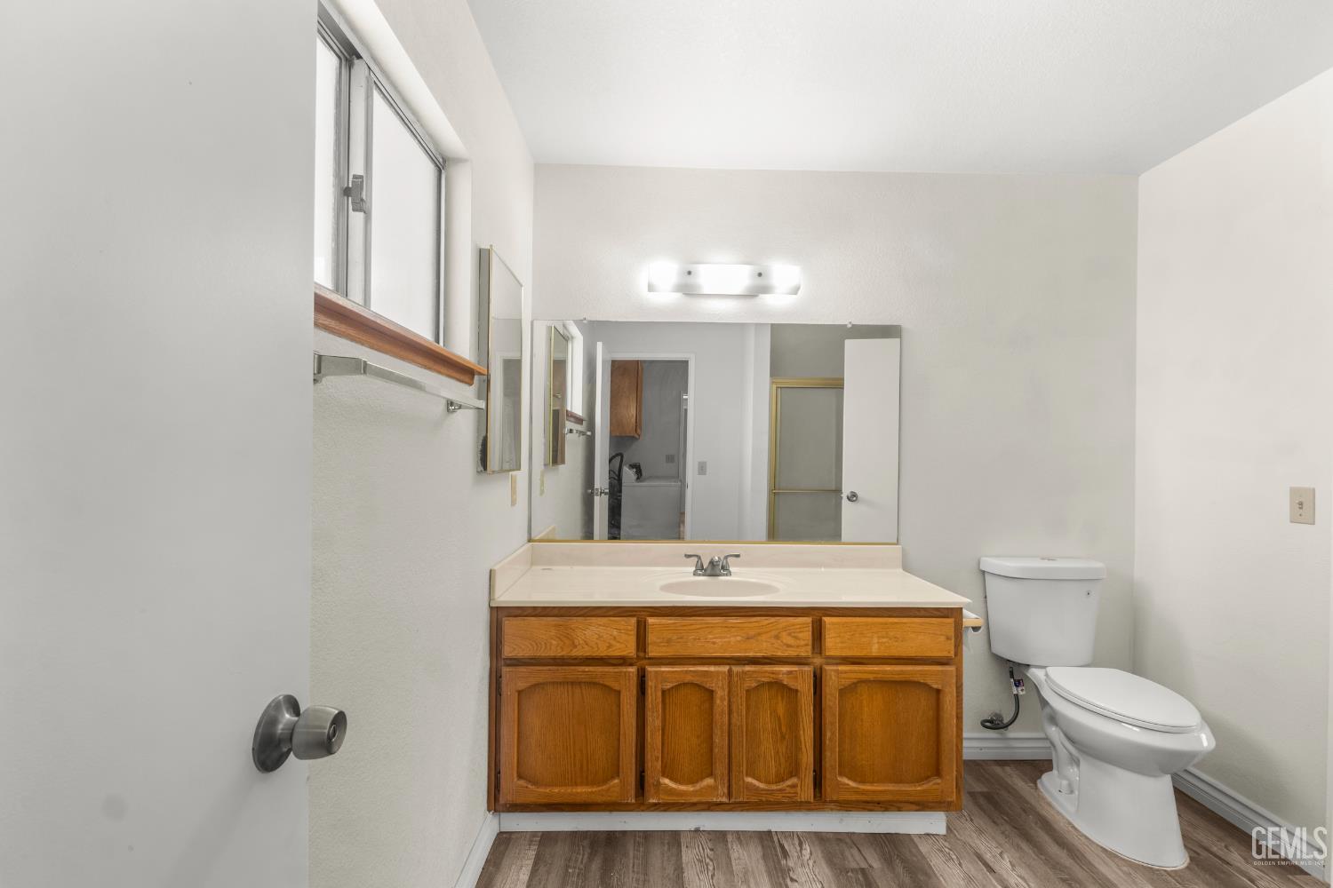 Undisclosed Address Ridgecrest, CA 93555 - Photo 19 of 28 a bathroom with a sink a toilet and mirror