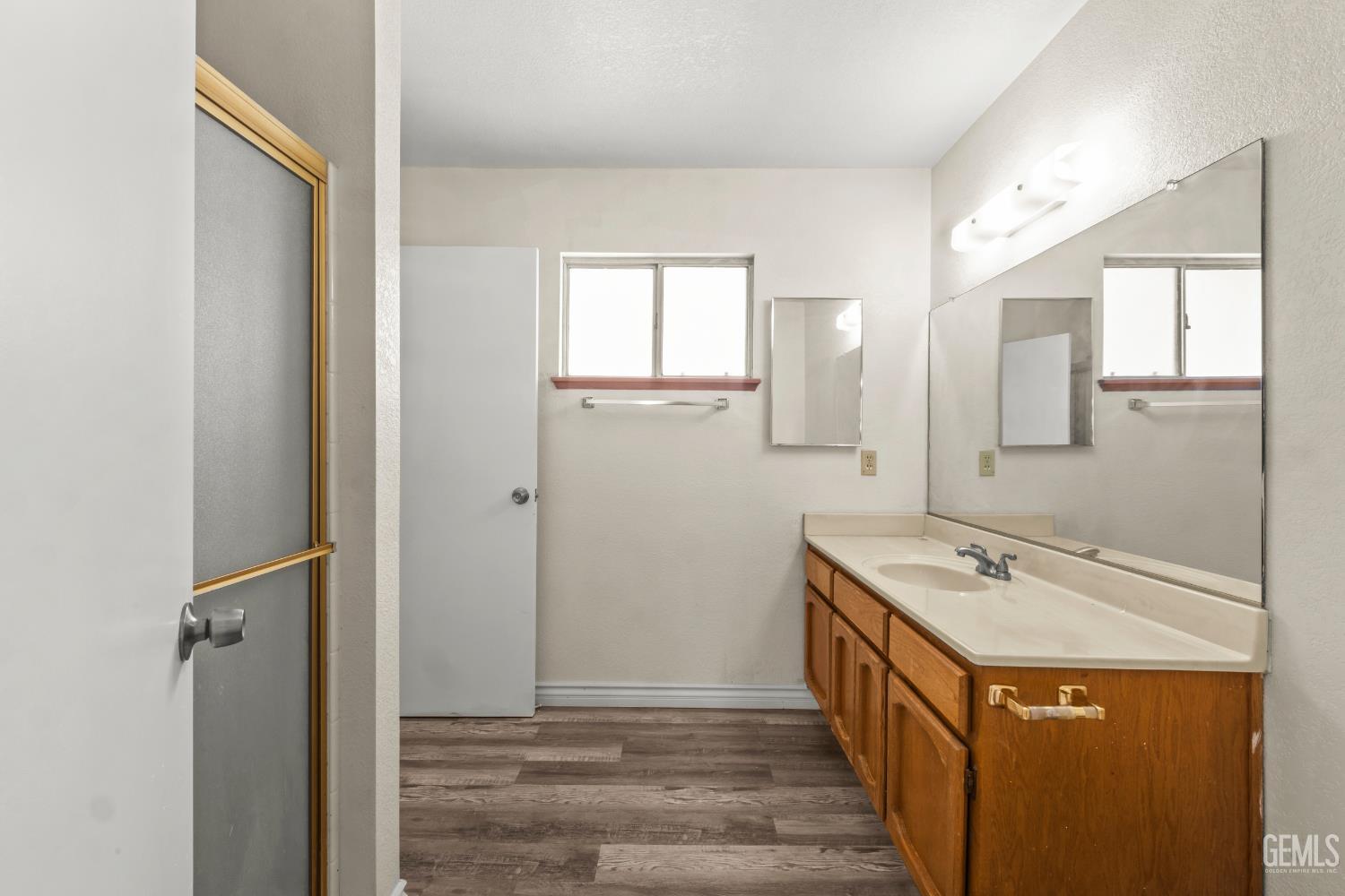 Undisclosed Address Ridgecrest, CA 93555 - Photo 20 of 28 a bathroom with a sink a mirror and a shower