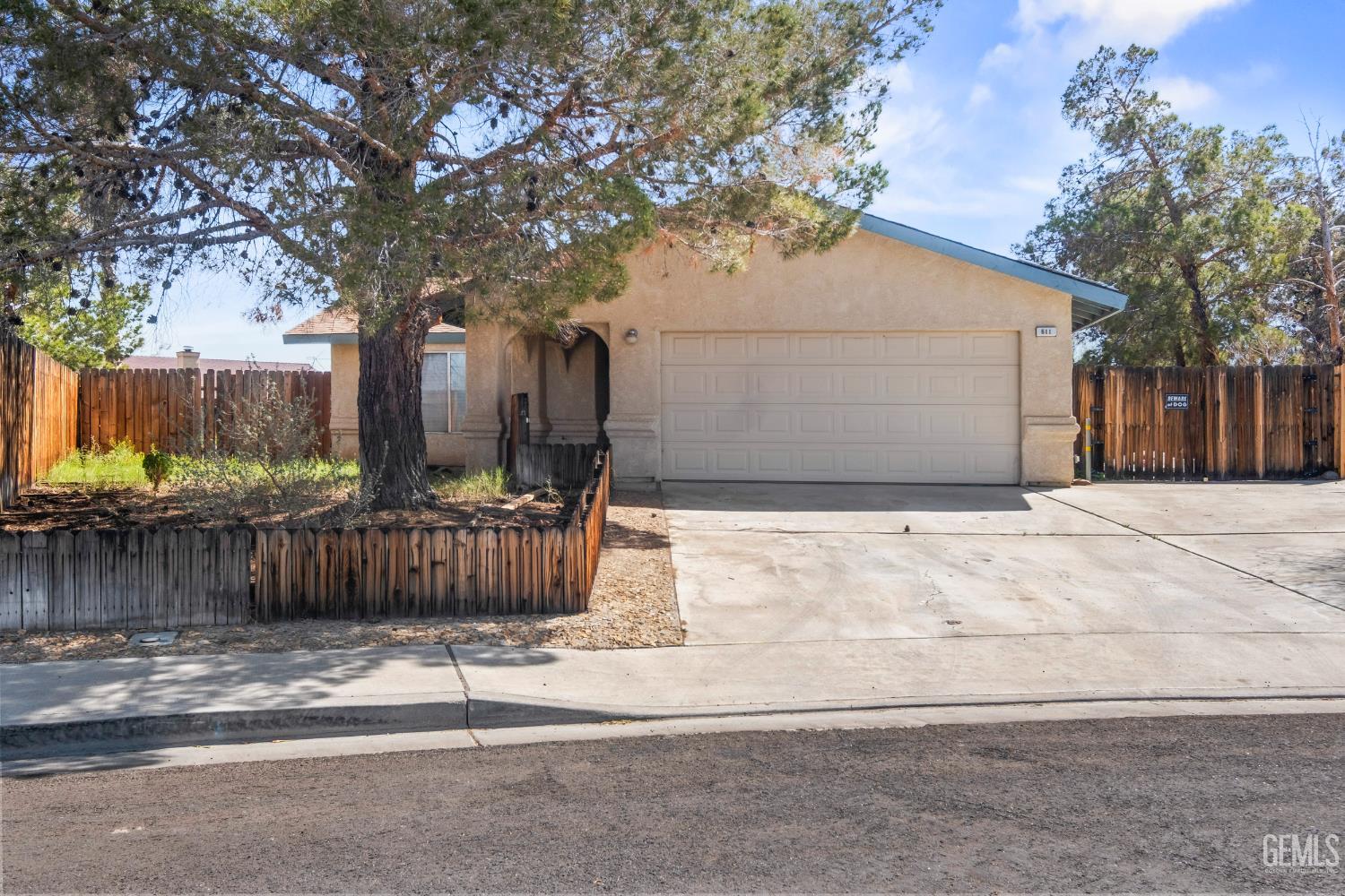 Undisclosed Address Ridgecrest, CA 93555 - Photo 2 of 28 a front view of a house with a yard