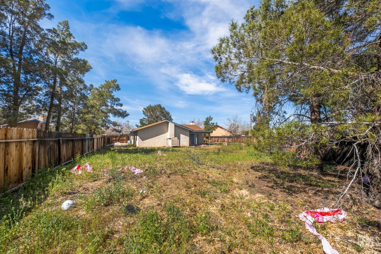 Undisclosed Address Ridgecrest, CA 93555 - Photo 23 of 28 a backyard of a house with table and chairs