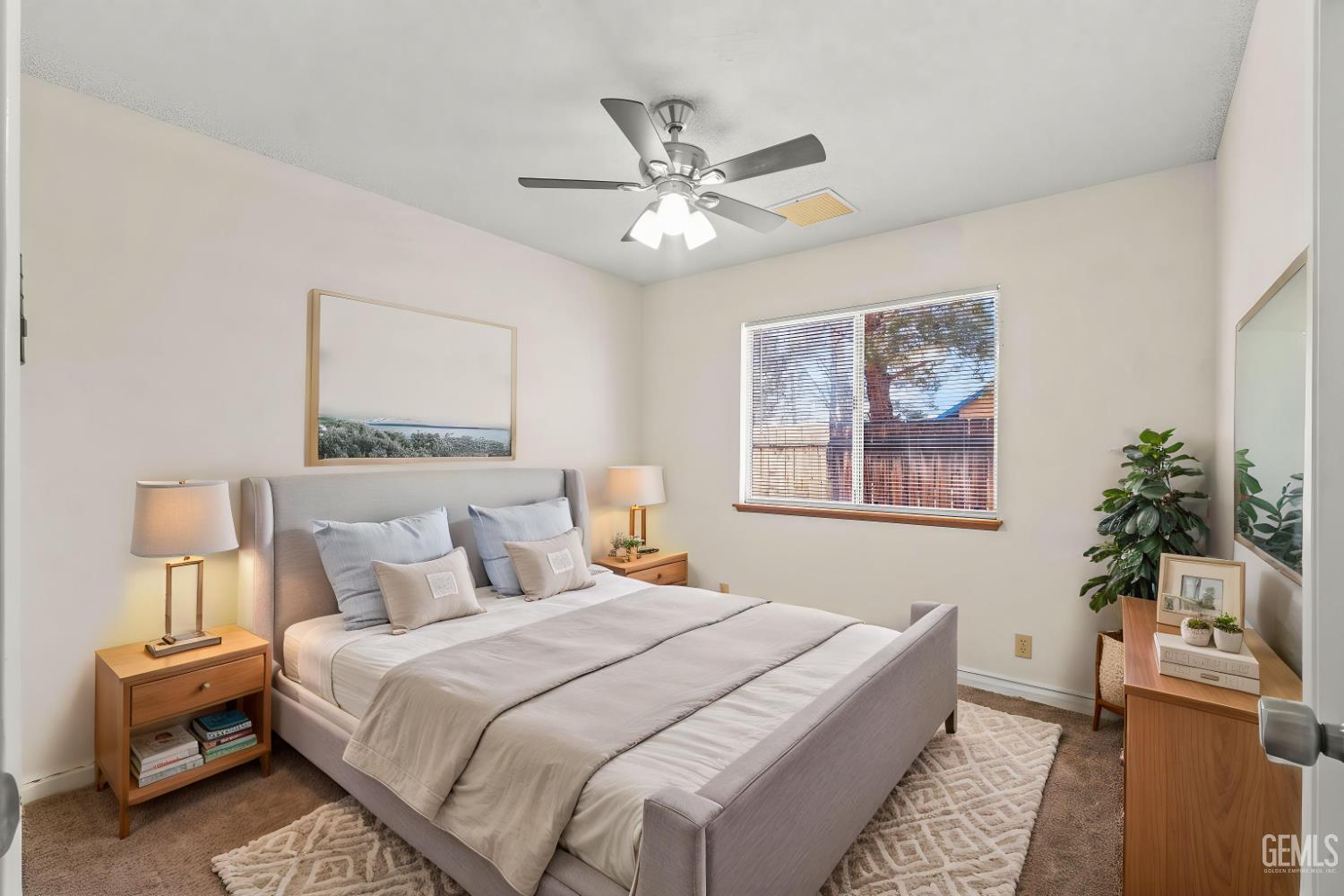 Undisclosed Address Ridgecrest, CA 93555 - Photo 27 of 28 a bedroom with a bed and a chandelier