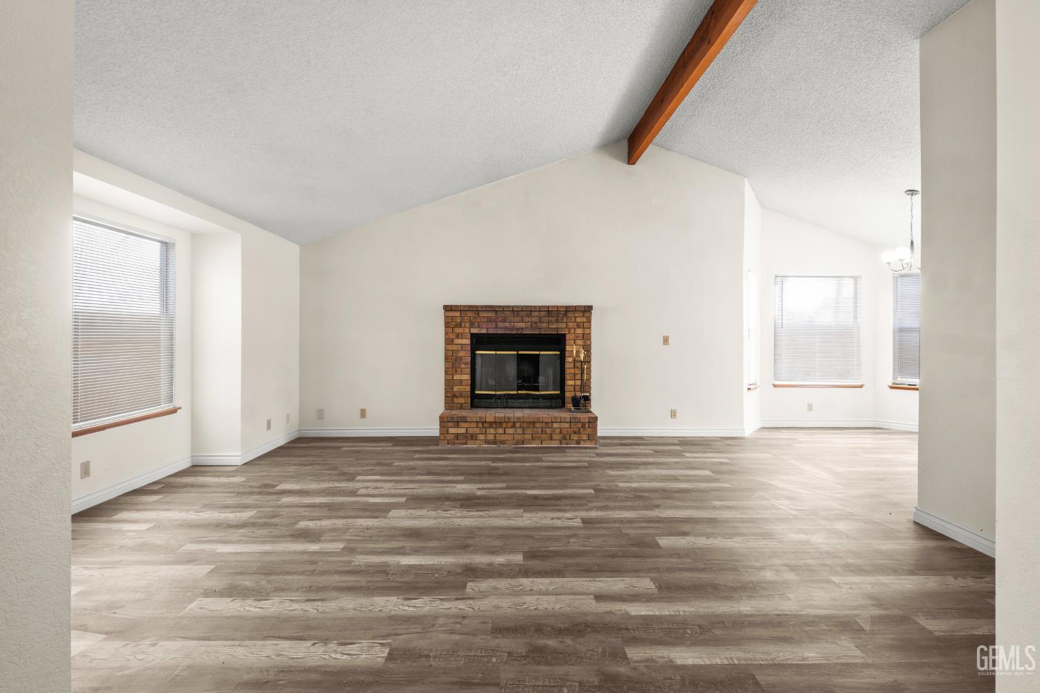 Undisclosed Address Ridgecrest, CA 93555 - Photo 5 of 28 a view of an empty room with wooden floor and a window