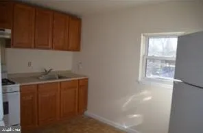 a utility room with cabinets washer and dryer