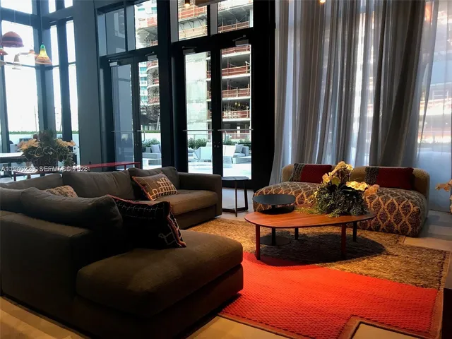 a large pool with table and chairs