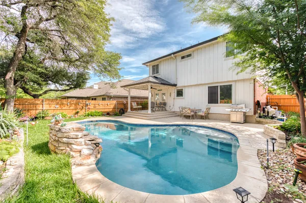 a view of a house with swimming pool