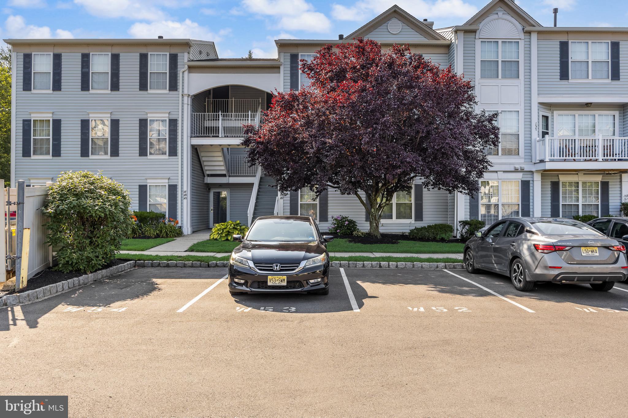 151 Wildflower Place Delran, NJ 08075 - Photo 1 of 29 a car parked in front of a brick house