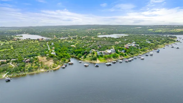 a view of a city street from a lake