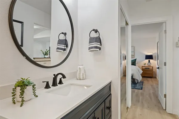 a bathroom with a sink and a mirror