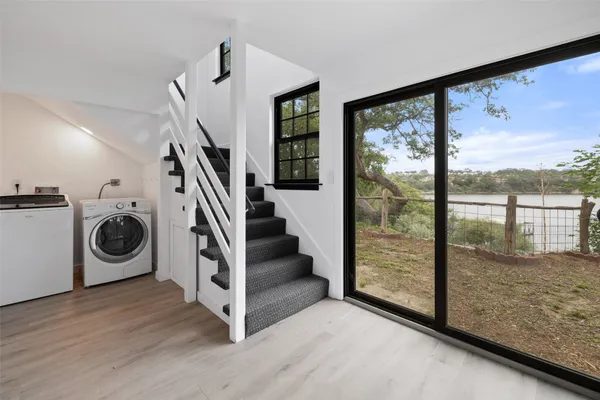 a view of hallway with washer and dryer