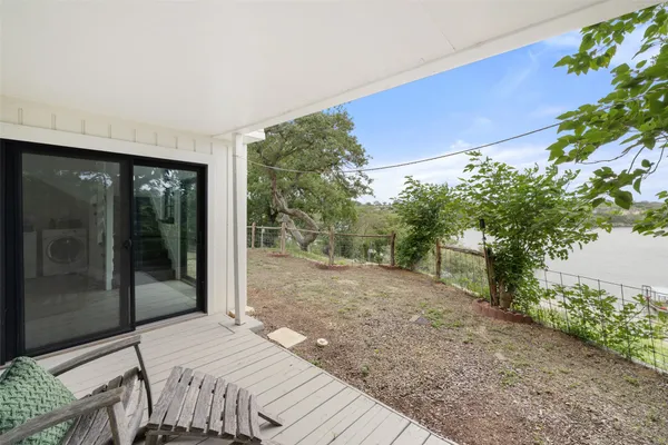 a bedroom with a bed and a potted plant