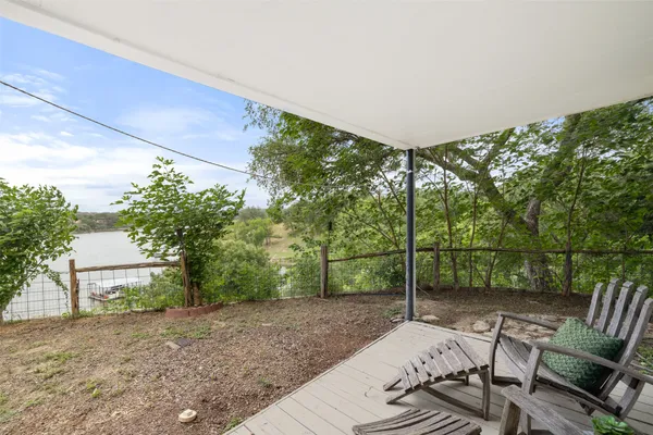 a view of a patio with table and chairs and potted plants