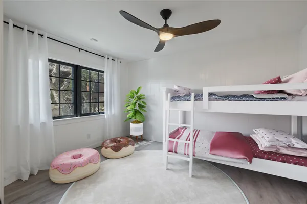 a bedroom with bed and a window