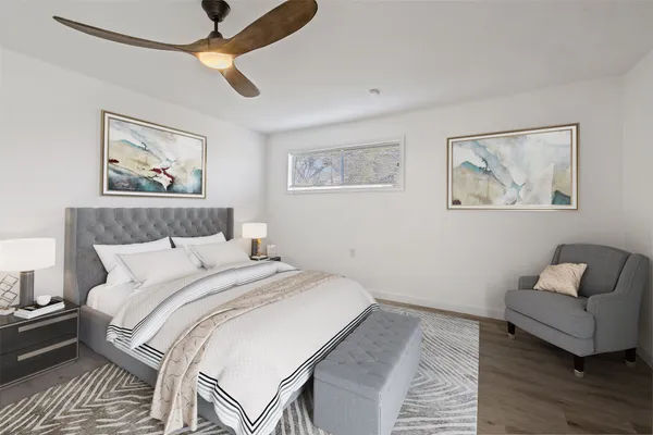 a bedroom with a bed and a couch