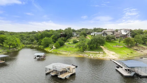 an aerial view of a house with a lake view
