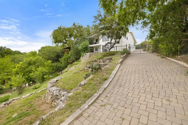 a view of a pathway with a yard