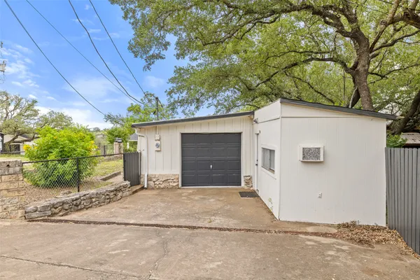 a view of a house with a yard and garage
