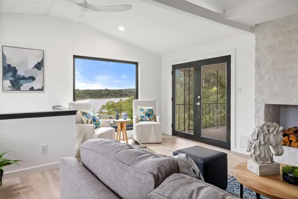 a living room with furniture and a large window