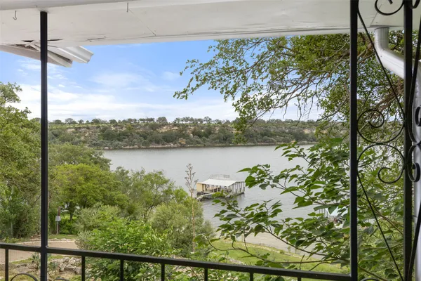 a view of a lake from a balcony