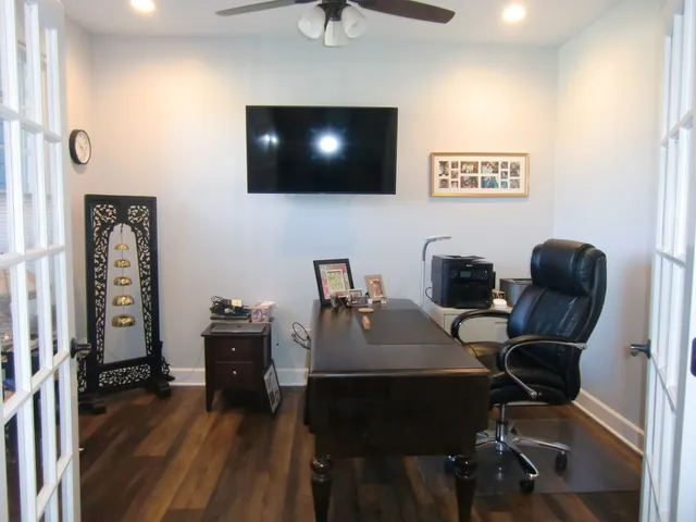 a view of a livingroom with furniture and a flat screen tv