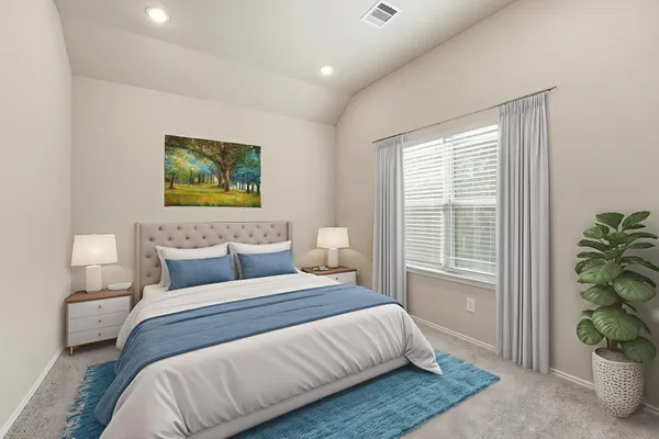a bedroom with a bed painting on wall and a potted plant