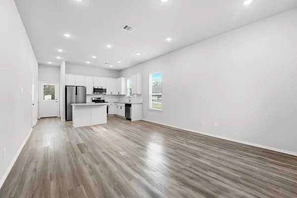 a view of kitchen with wooden floor
