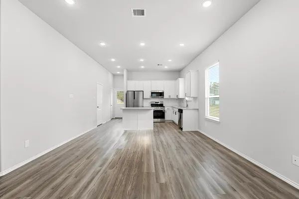 a view of kitchen with wooden floor