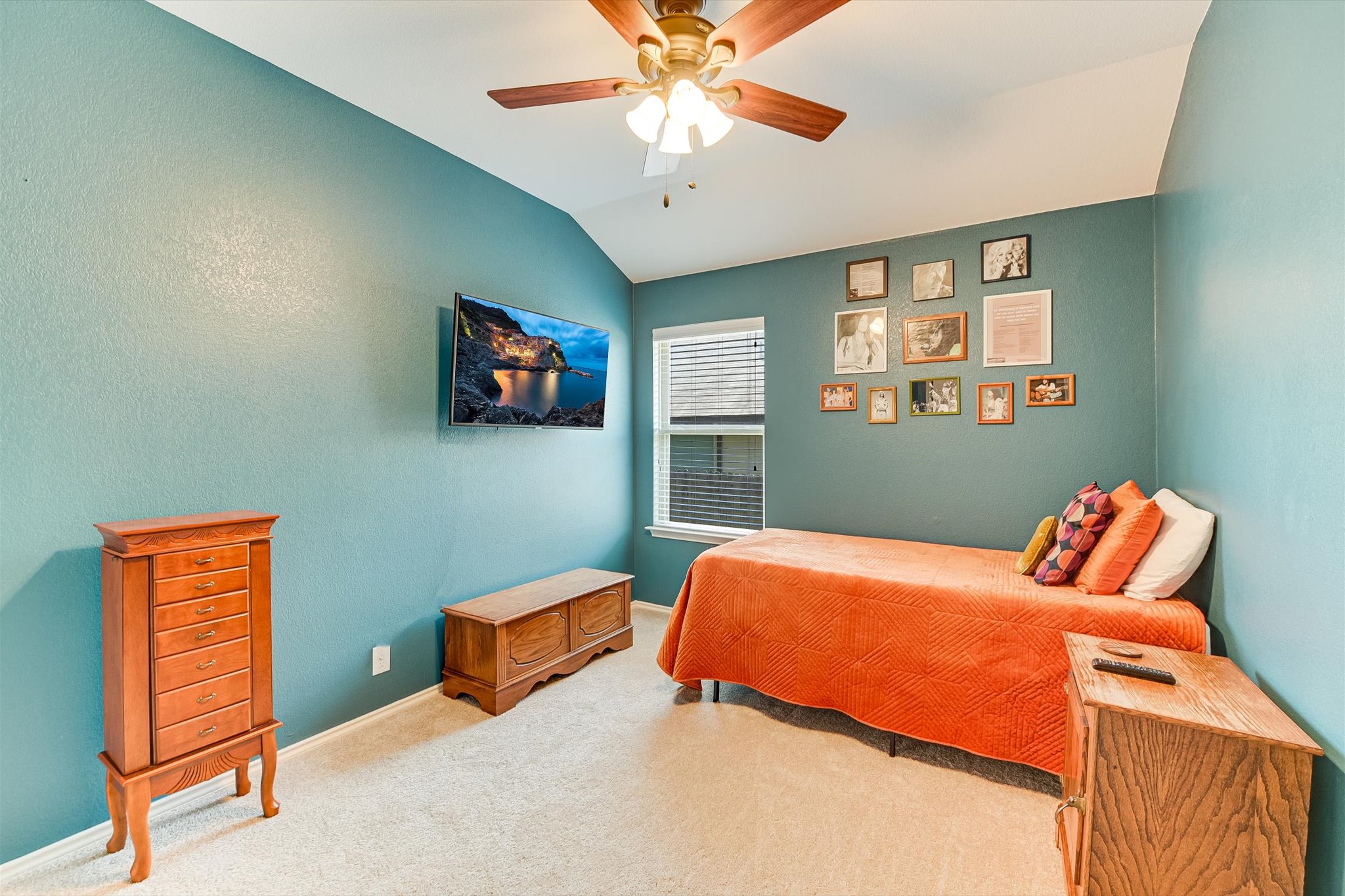 536 Dragon Ridge Road Buda, TX 78610 - Photo 17 of 20 Bedroom featuring vaulted ceilings and a ceiling fan