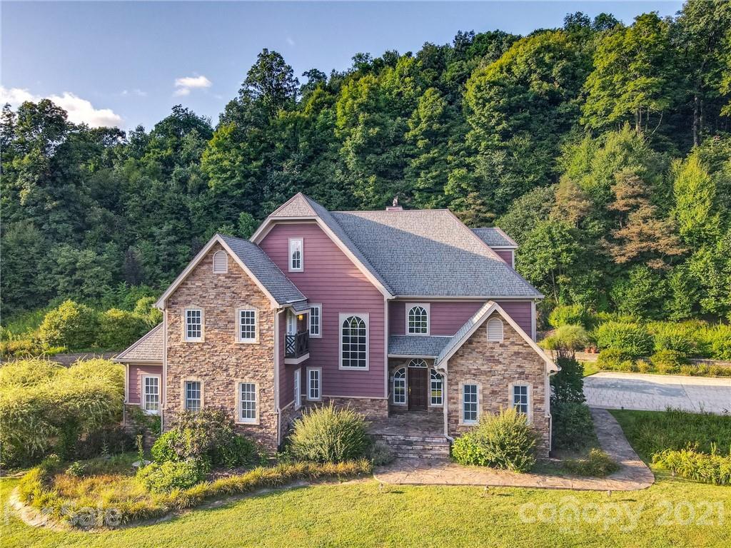127 Alan Drive Boone, NC 28607 - Photo 2 of 37 a front view of a house with a yard and garage