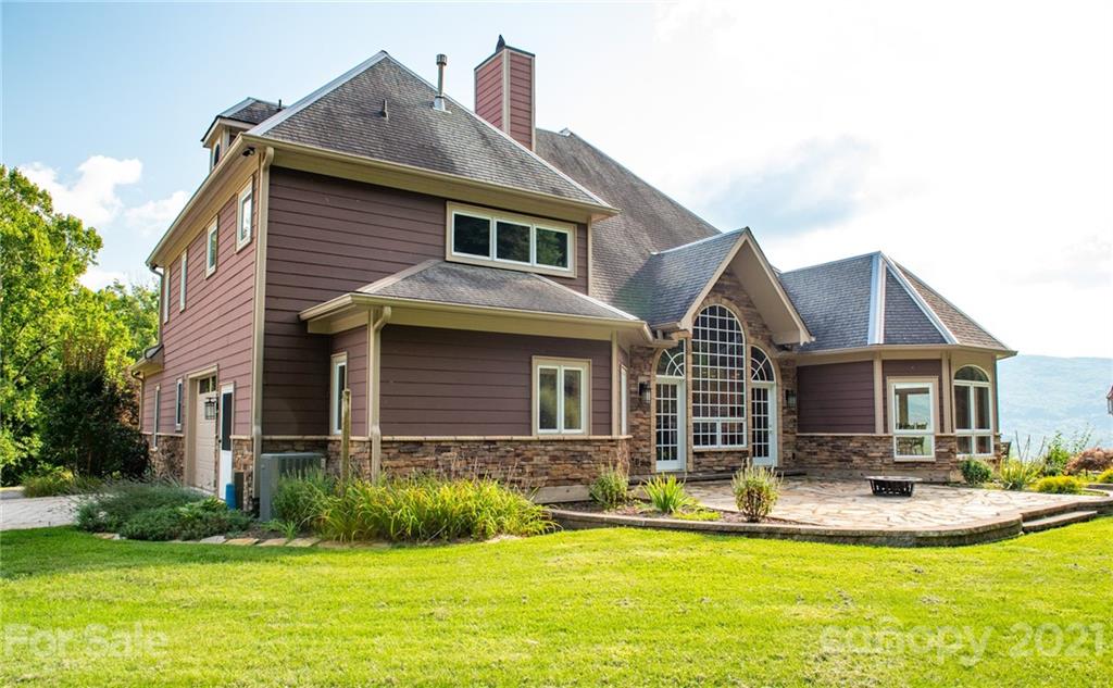 127 Alan Drive Boone, NC 28607 - Photo 15 of 37 a front view of house with yard and green space