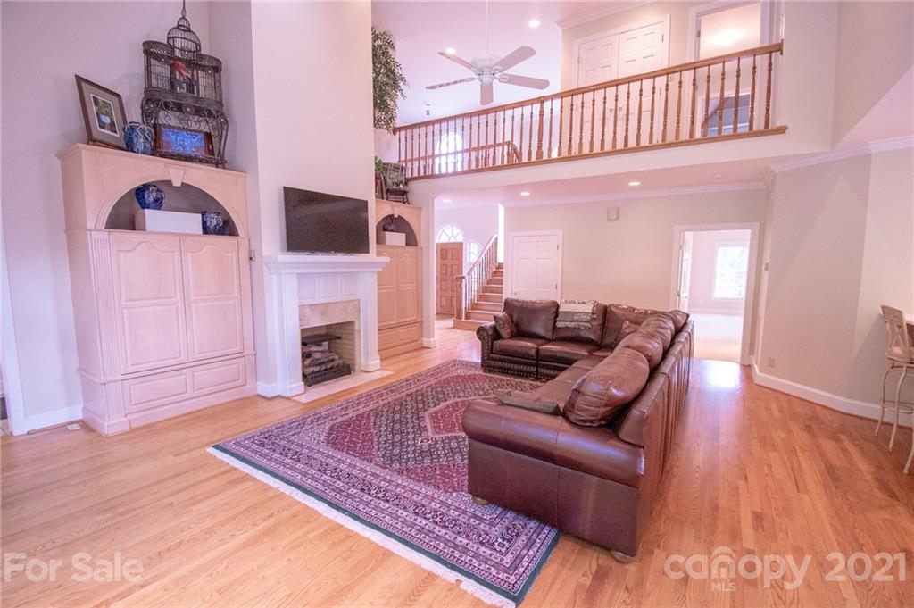127 Alan Drive Boone, NC 28607 - Photo 18 of 37 a living room with furniture a flat screen tv and a fireplace