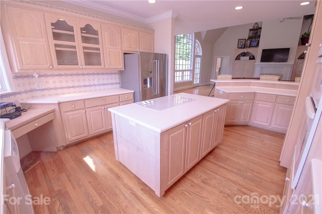 127 Alan Drive Boone, NC 28607 - Photo 19 of 37 a kitchen with a stove a refrigerator and cabinets