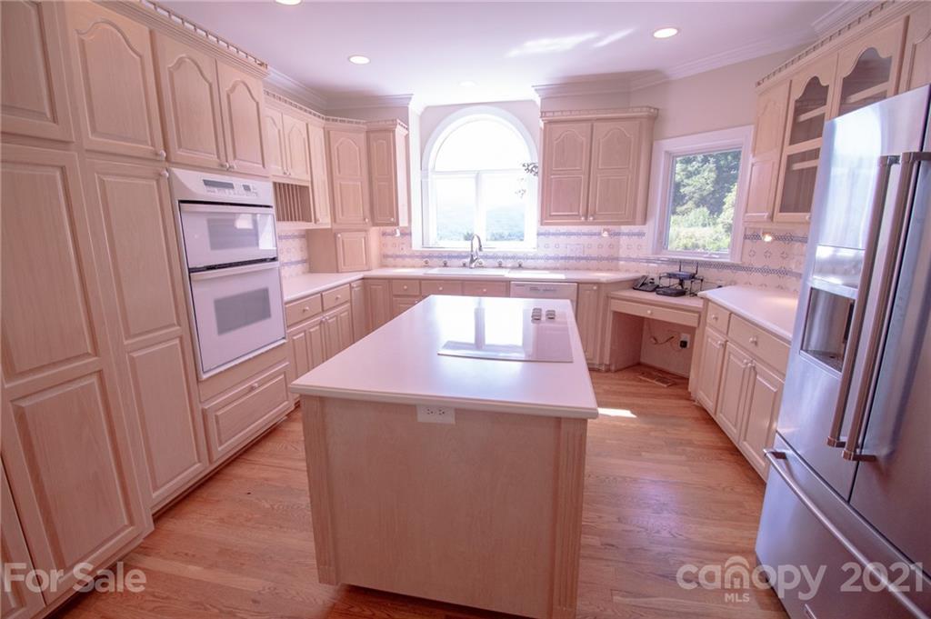 127 Alan Drive Boone, NC 28607 - Photo 20 of 37 a kitchen with stainless steel appliances granite countertop a sink stove and refrigerator
